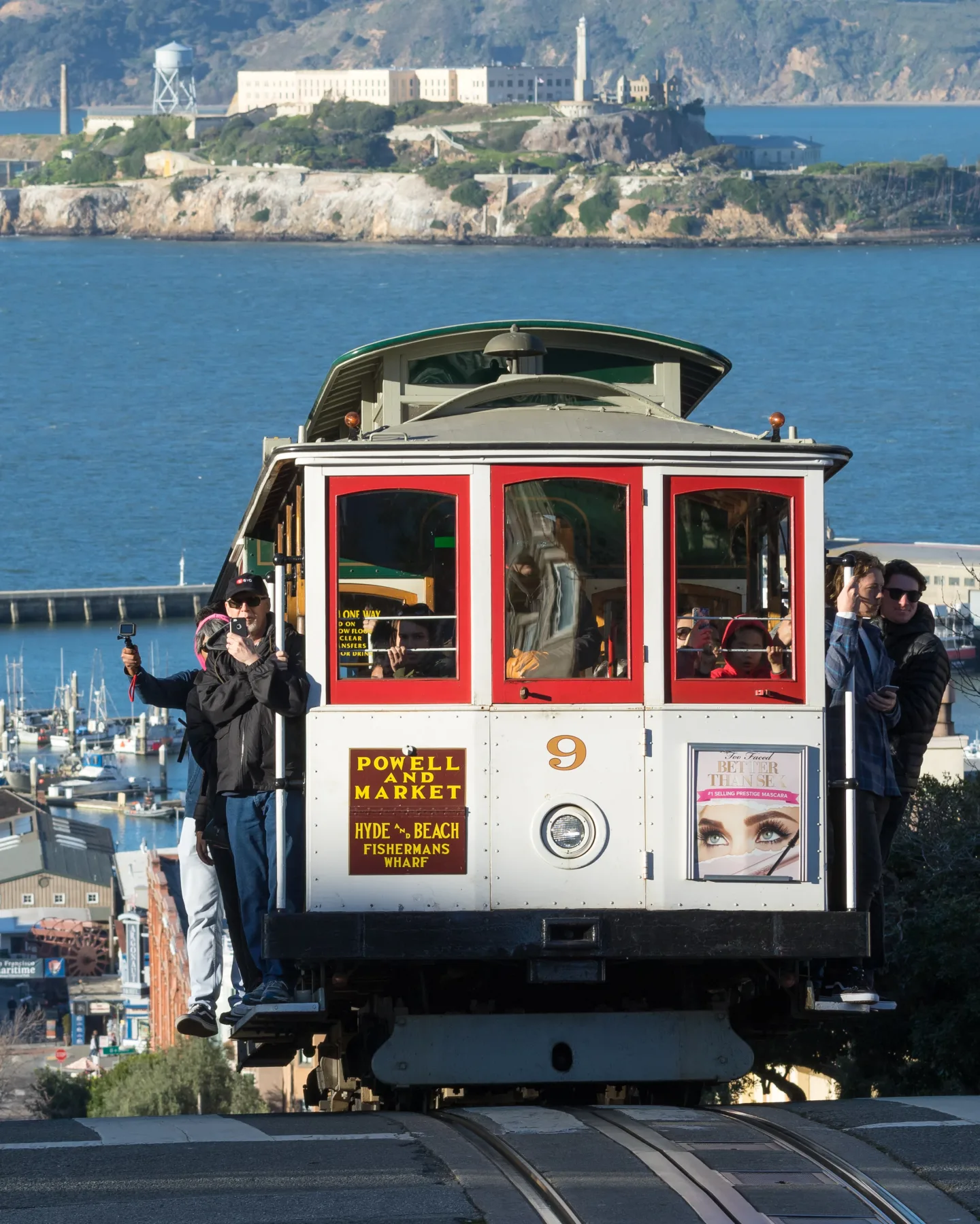 San Francisco cable car traveling on Hyde Street with the bay beyond
